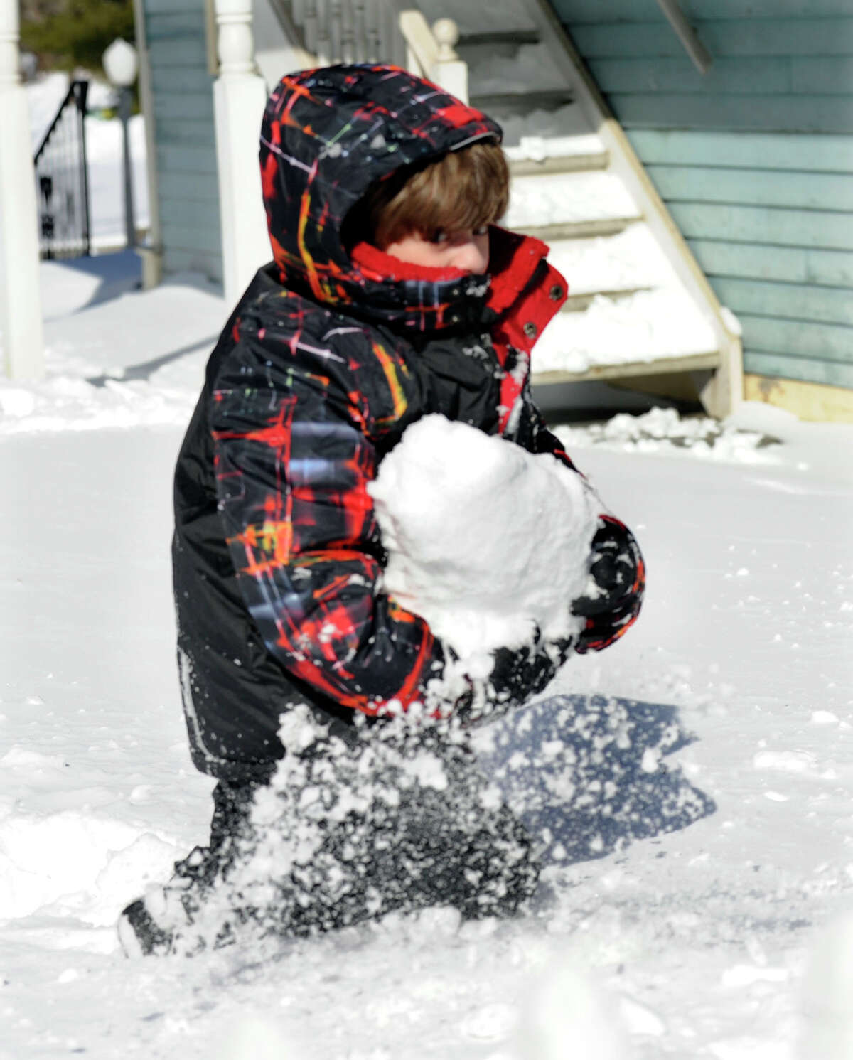 Maximo Dinardo, 6, plays in the snow near his home in Sandy Hook, Conn. Saturday, February 9, 2013. A blizzard dumped hearly two feet of snow in the area.