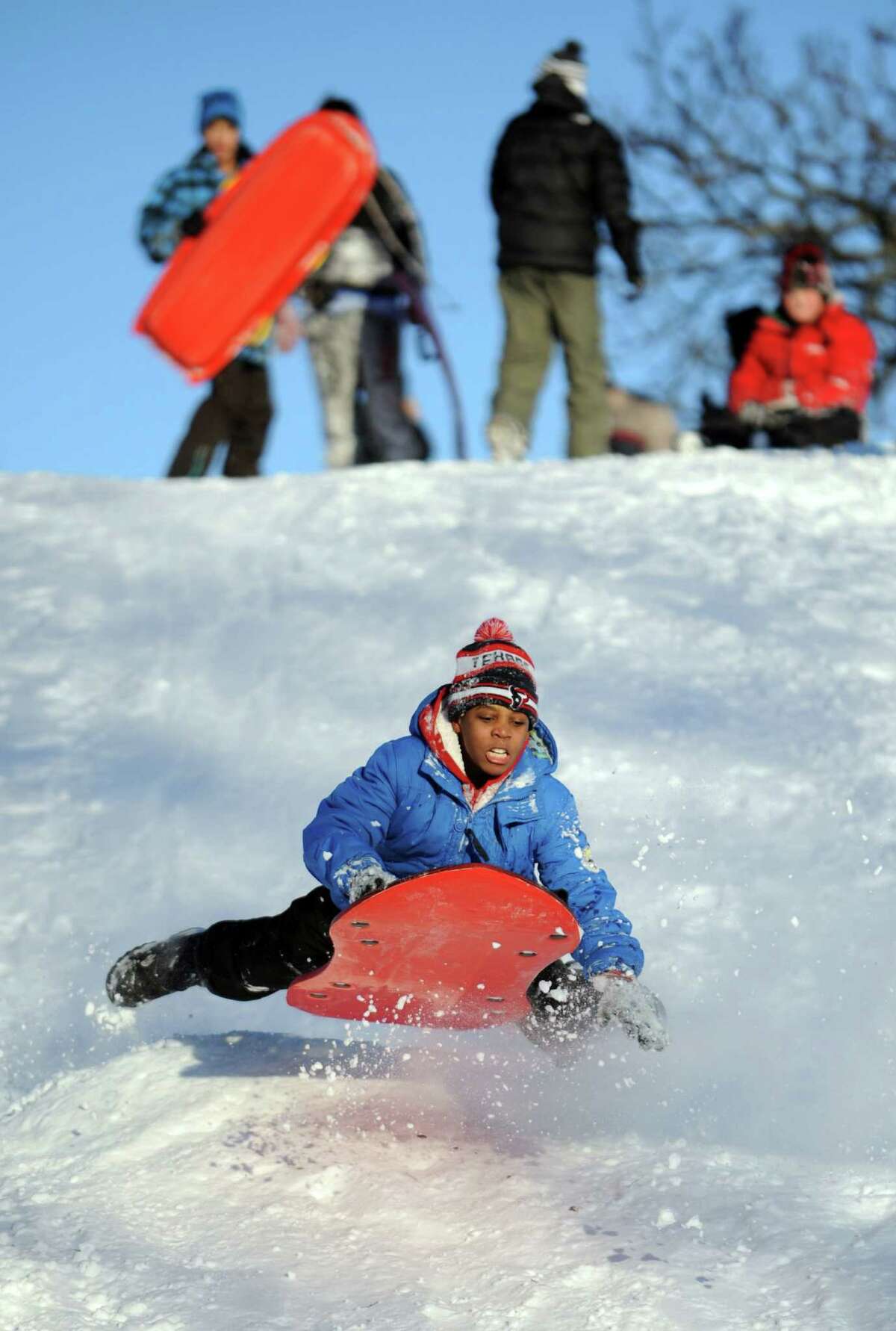 A.J. Cooper catches air on a hill in Cummings Park in Stamford, Conn., on Saturday, February 9, 2013.