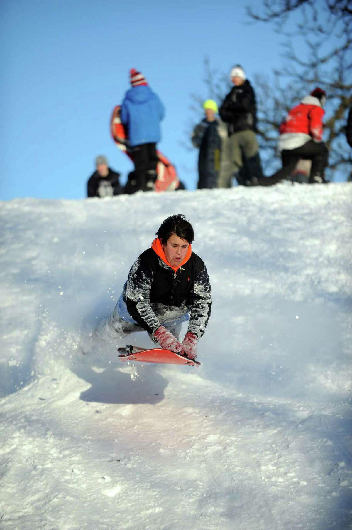 Hunter Bridges catches air on a hill in Cummings Park in Stamford, Conn., on Saturday, February 9, 2013.