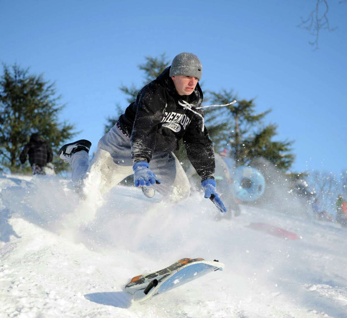 Marc Grasso catches air on a hill in Cummings Park in Stamford, Conn., on Saturday, February 9, 2013.