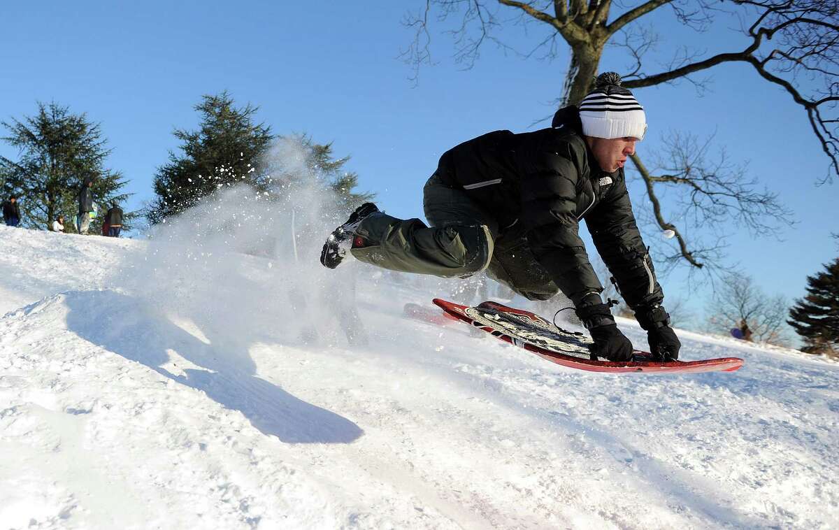 Claudio Fidaleo catches air on a hill in Cummings Park in Stamford, Conn., on Saturday, February 9, 2013.