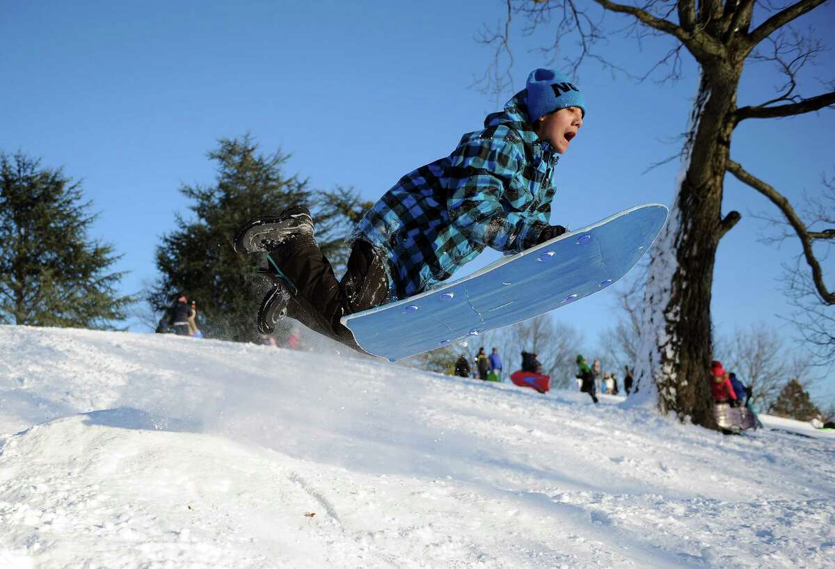 Zai Nishimura catches air on a hill in Cummings Park in Stamford, Conn., on Saturday, February 9, 2013.