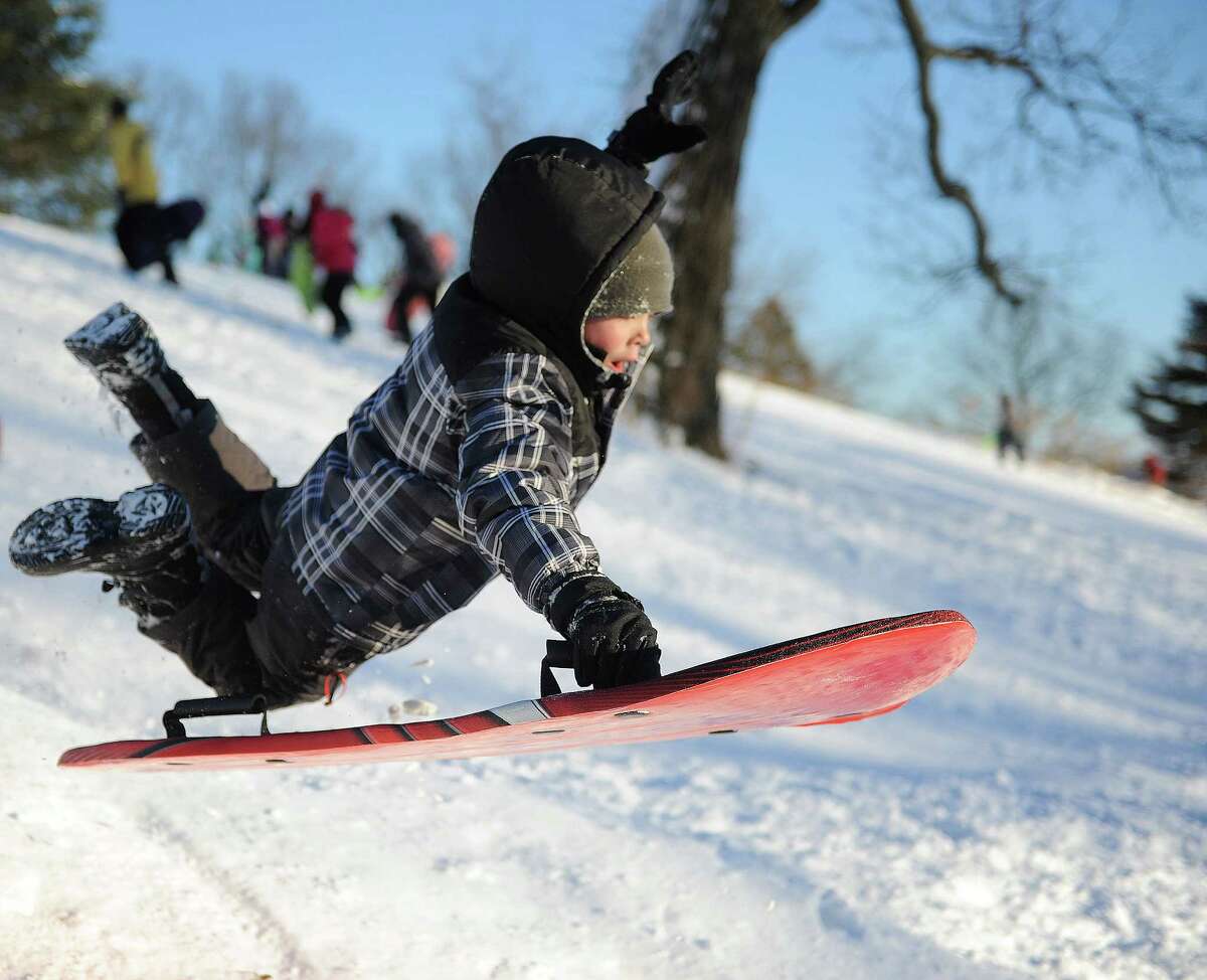 Liam Baird, 9, catches air on a hill in Cummings Park in Stamford, Conn., on Saturday, February 9, 2013.
