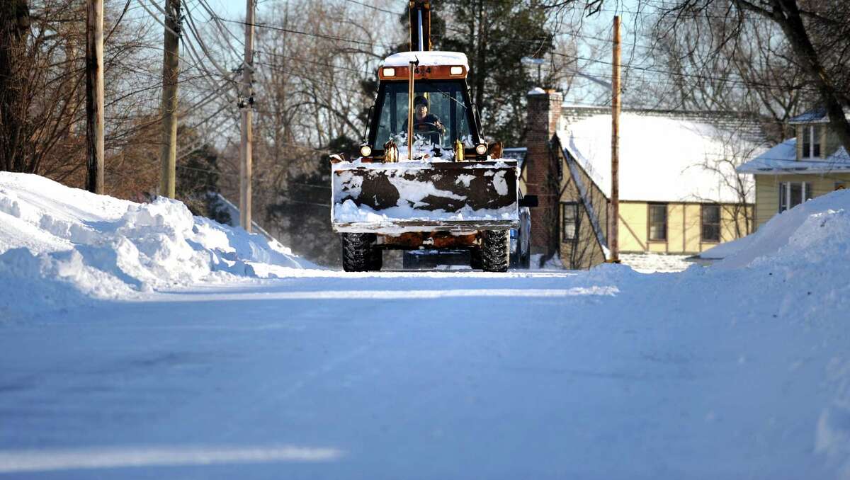 Residents in Derby, Conn. face massive snow removal Saturday, Feb. 9, 2013 following a severe blizzard that dumped up to three feet of snow across the state.
