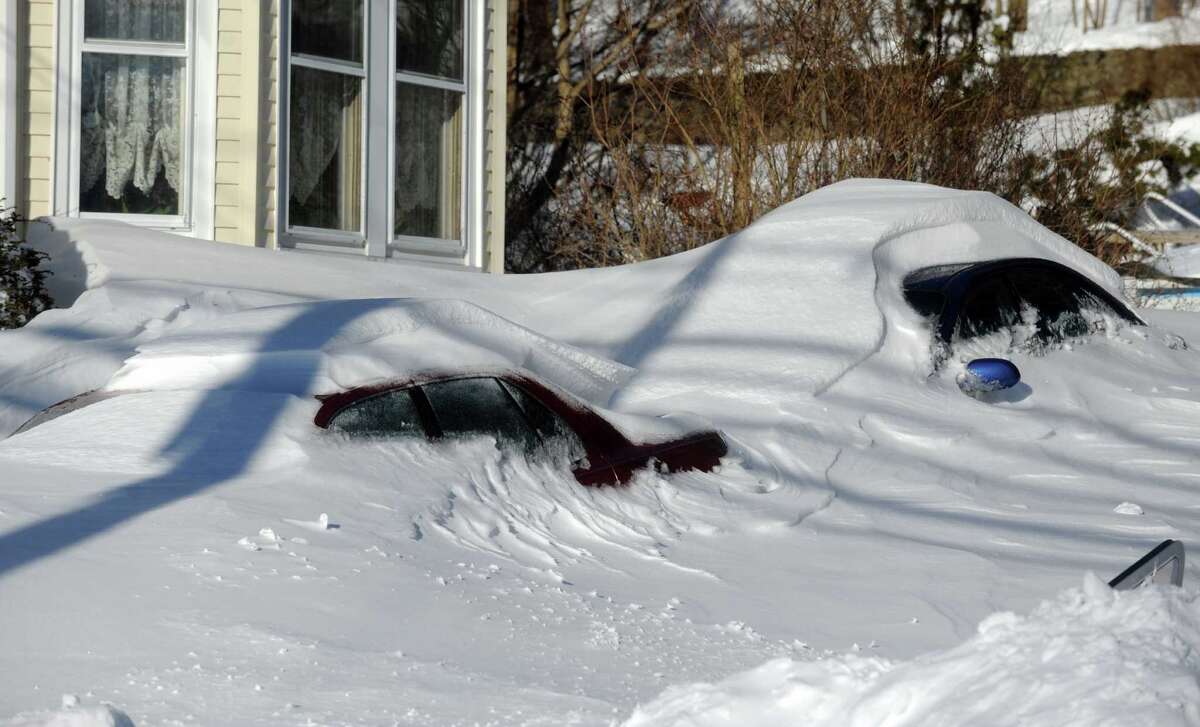 Residents in Derby, Conn. face massive snow removal Saturday, Feb. 9, 2013 following a severe blizzard that dumped up to three feet of snow across the state.