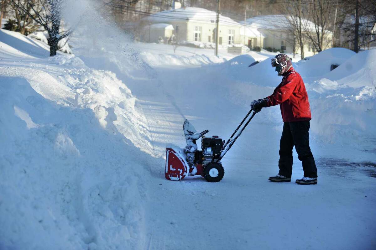 Residents in Derby, Conn. face massive snow removal Saturday, Feb. 9, 2013 following a severe blizzard that dumped up to three feet of snow across the state.