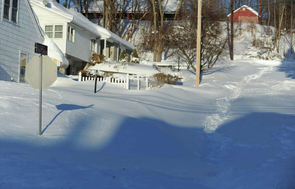 Most side roads in Derby, Conn. remain covered in snow Saturday, Feb. 9, 2013 following a blizzard that dumped up to three feet of snow across the state.