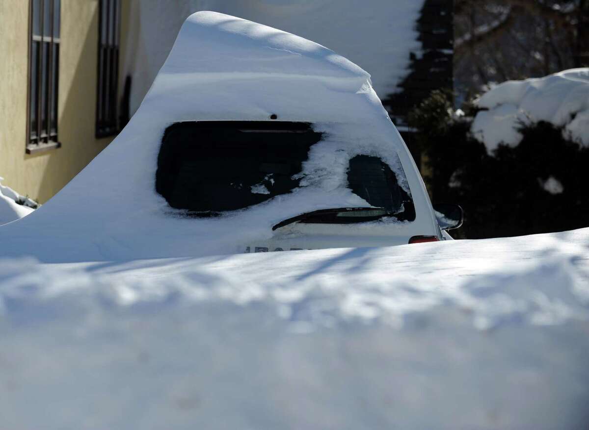 Residents in Derby, Conn. face massive snow removal Saturday, Feb. 9, 2013 following a severe blizzard that dumped up to three feet of snow across the state.