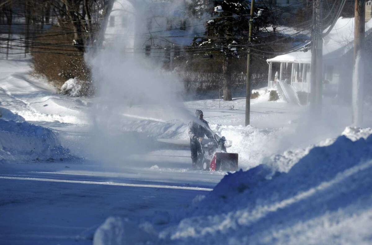Residents in Derby, Conn. face massive snow removal Saturday, Feb. 9, 2013 following a severe blizzard that dumped up to three feet of snow across the state.
