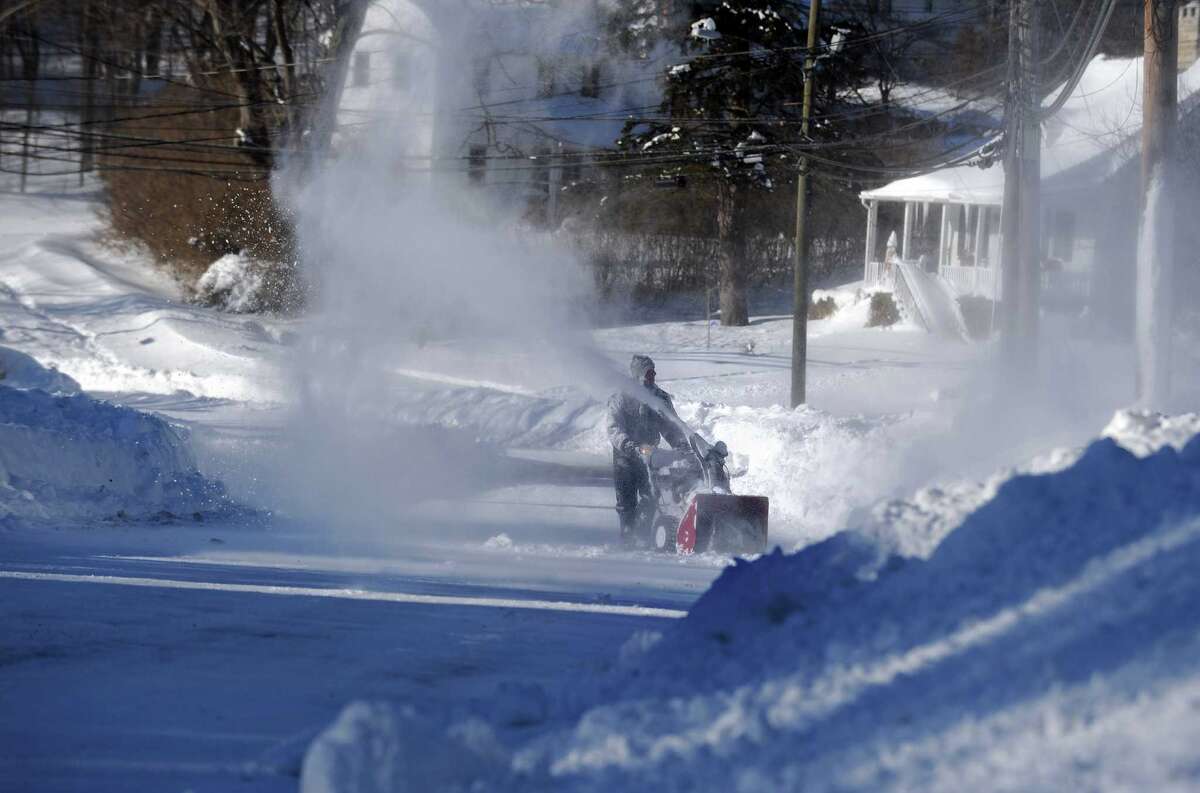 Residents in Derby, Conn. face massive snow removal Saturday, Feb. 9, 2013 following a severe blizzard that dumped up to three feet of snow across the state.