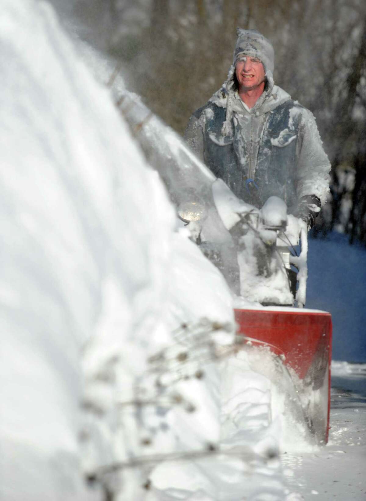 Residents in Derby, Conn. face massive snow removal Saturday, Feb. 9, 2013 following a severe blizzard that dumped up to three feet of snow across the state.