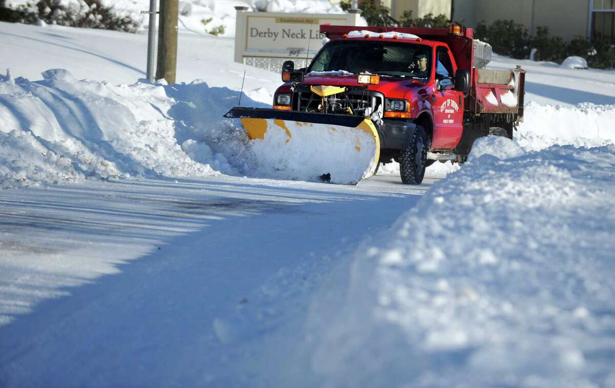 Residents in Derby, Conn. face massive snow removal Saturday, Feb. 9, 2013 following a severe blizzard that dumped up to three feet of snow across the state.