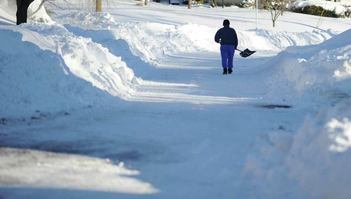 Residents in Derby, Conn. face massive snow removal Saturday, Feb. 9, 2013 following a severe blizzard that dumped up to three feet of snow across the state.
