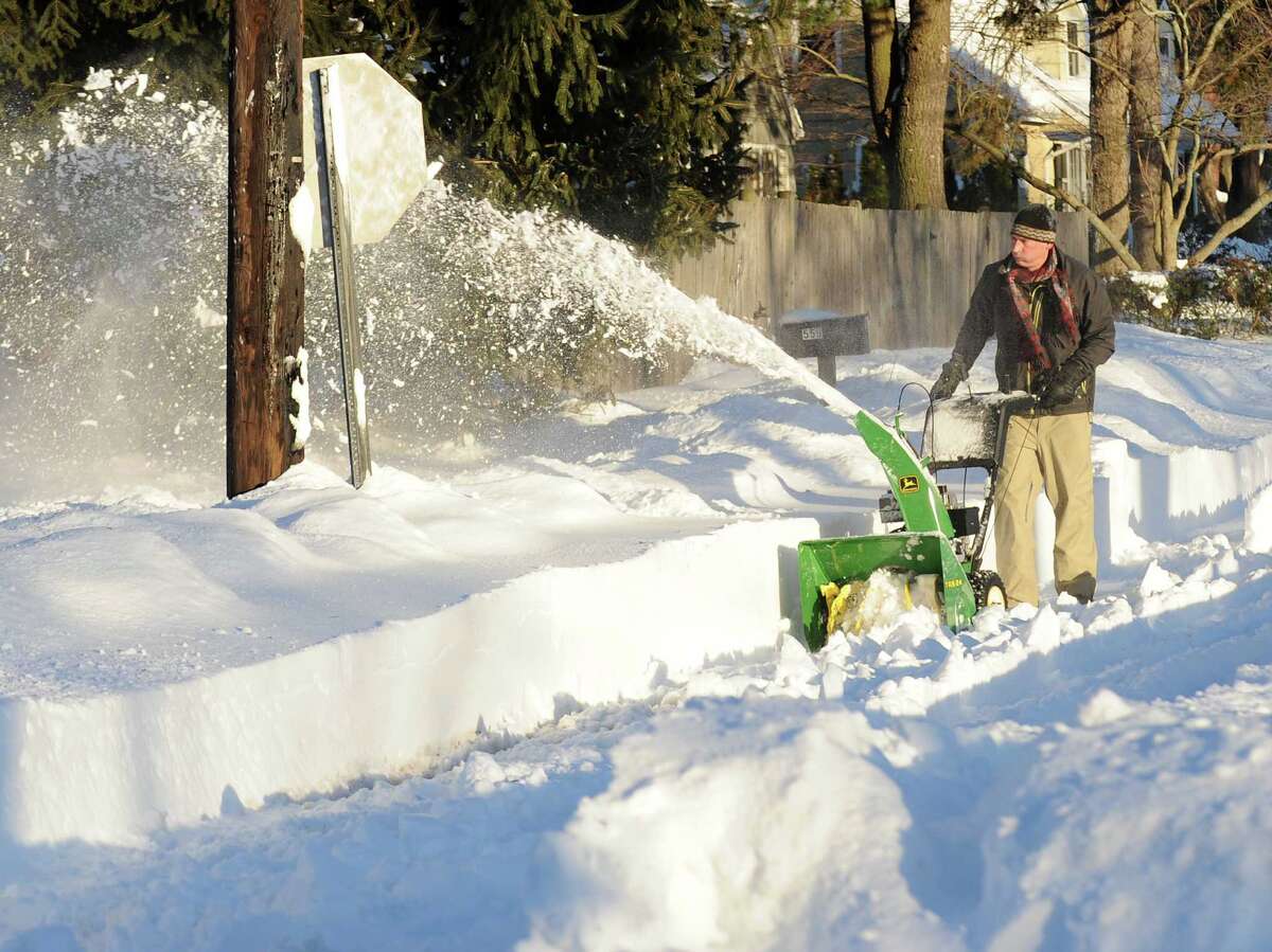 Jeff Norton uses a snow blower to clear Melody Lane in Fairfield, Conn. on Friday, Feb. 9, 2013. The street had yet to be plowed and he wanted to be able to get out because his mother in Westport was without power. Her power had since come back on but he decide to continue and maybe go out for pizza. Southwestern Connecticut was hit by one of the biggest snowstorms in history, a howling blizzard that dumped over two feet of snow across area.