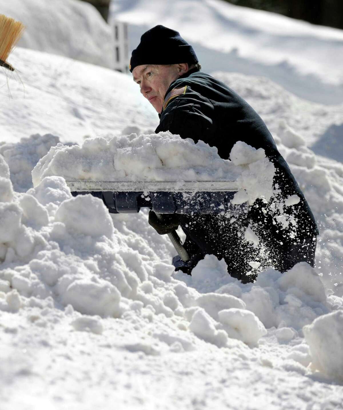 Bob Martin, of Nashville Road in Bethel, Conn. digs out after a blizzard dumps almost two feet of snow in the area Friday and early Saturday morning, Feb. 9, 2013.