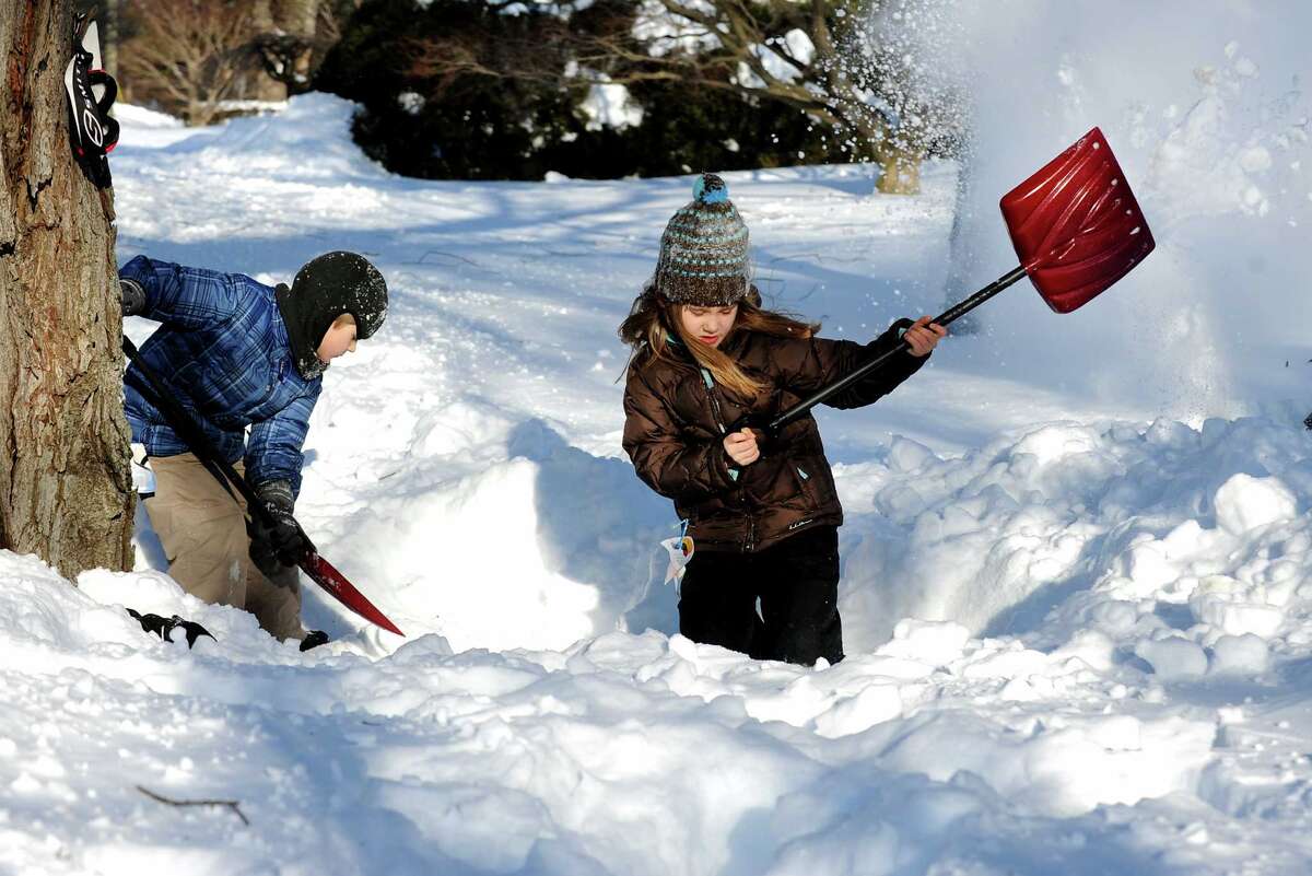 Charlie and Della Jackson work making a fort in their driveway on Stillson Rd. in Fairfield, Conn. on Friday, Feb. 9, 2013. Southwestern Connecticut was hit by one of the biggest snowstorms in history, a howling blizzard that dumped over two feet of snow across the area.