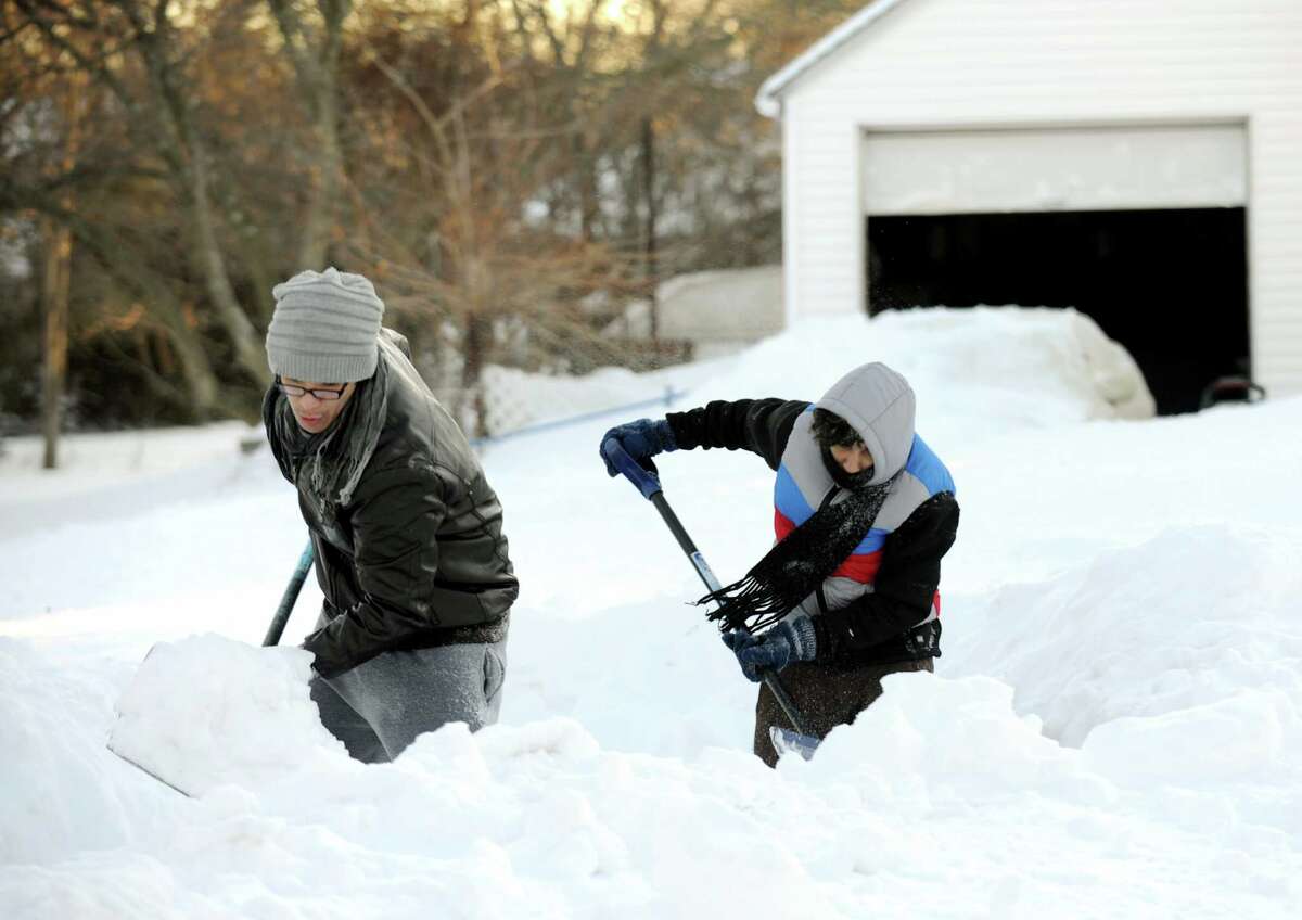 Residents continue to shovel their way out on Judd St. in Fairfield, Conn. on Friday, Feb. 9, 2013. Southwestern Connecticut was hit by one of the biggest snowstorms in history, a howling blizzard that dumped over two feet of snow across the area.