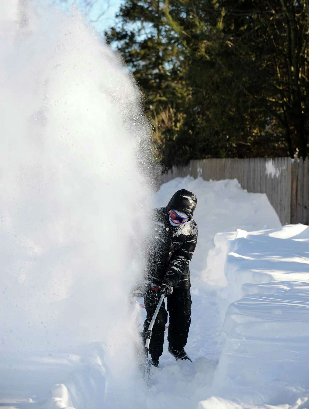 Kathleen Jackson clears her driveway on Stillson Rd. in Fairfield, Conn. on Friday, Feb. 9, 2013. Southwestern Connecticut was hit by one of the biggest snowstorms in history, a howling blizzard that dumped over two feet of snow across the area.