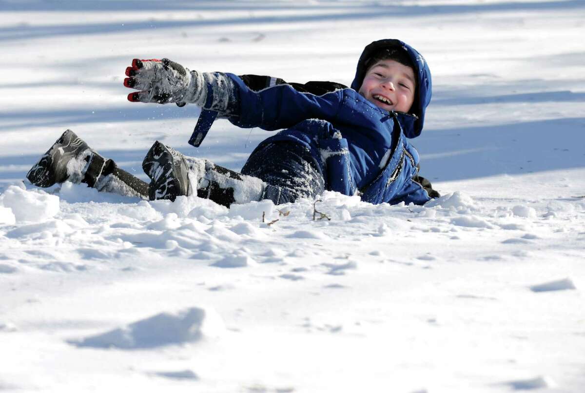 Evan Smith plays on an unshoveled Mayfair Rd. in Fairfield, Conn. on Friday, Feb. 9, 2013. Southwestern Connecticut was hit by one of the biggest snowstorms in history, a howling blizzard that dumped over two feet of snow across the area.