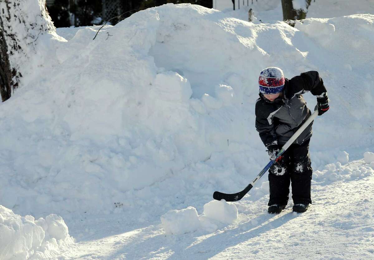 Dylan Hutzelmann makes an igloo in his driveway in Fairfield, Conn. on Friday, Feb. 9, 2013. Southwestern Connecticut was hit by one of the biggest snowstorms in history, a howling blizzard that dumped over two feet of snow across the area.