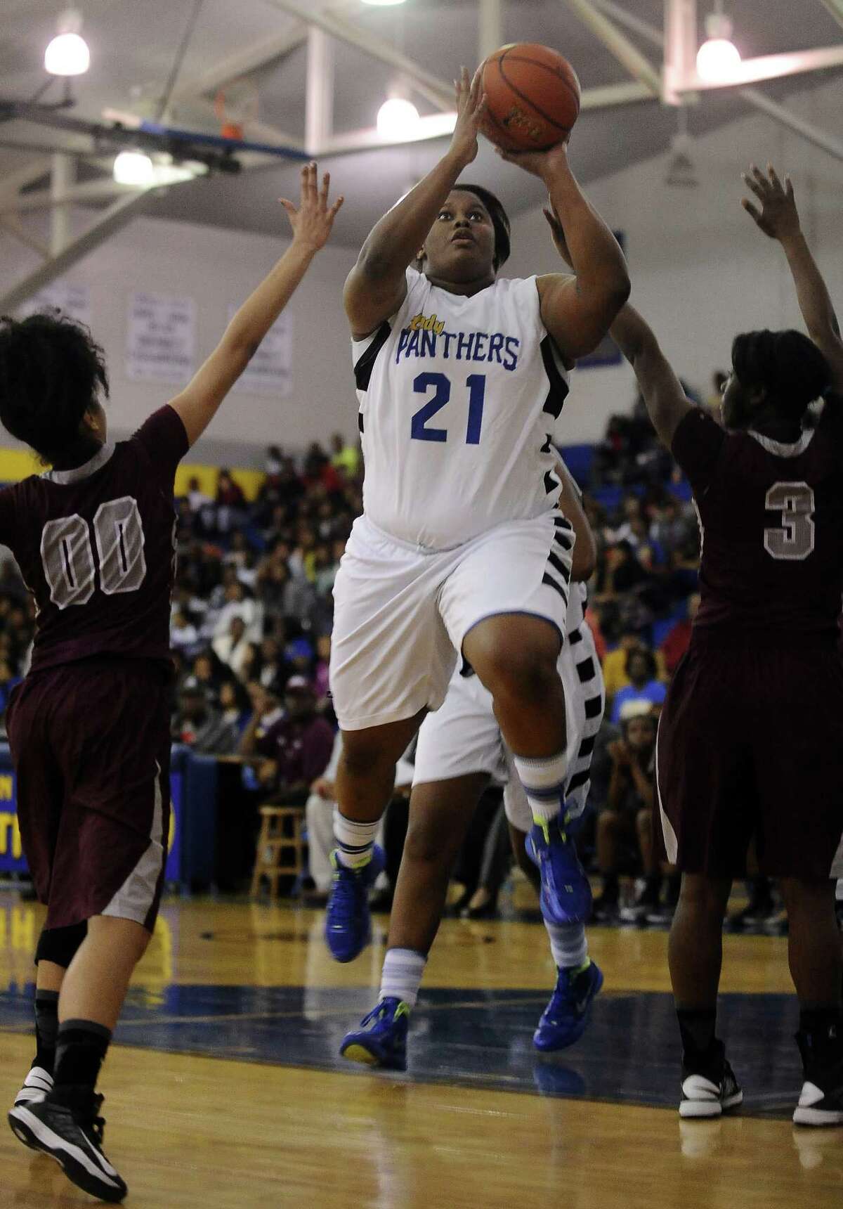 Ozen Lady Panther Nekia Jones, #21, puts it up for two during the Ozen High School girls basketball game against Central High School on Tuesday, January 22, 2013, at Ozen High School. Ozen won 63 - 53. Photo taken: Randy Edwards/The Enterprise