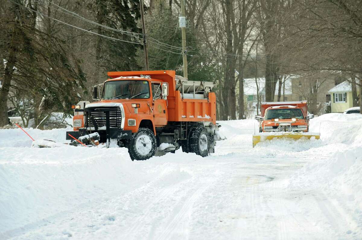 Plows work in tandem to clearKatona Dr. in Fairfield, Conn. on Saturday, Feb. 9, 2013.