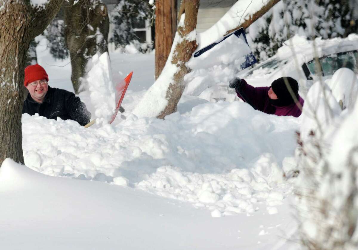 Residents on Bel Air Lane dig out after a overnight blizzard dumped over two feet of snow in Fairfield, Conn. on Saturday, Feb. 9, 2013.