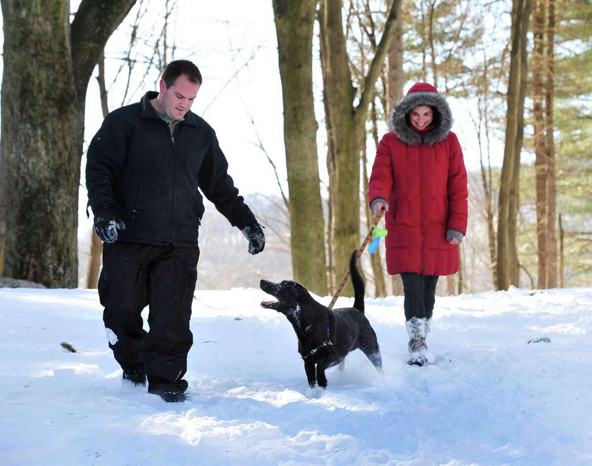 Nathan Archer and Rebecca Goetz walk Biern at Tarrywile Park in Danbury, Sunday, Feb. 10, 2013.