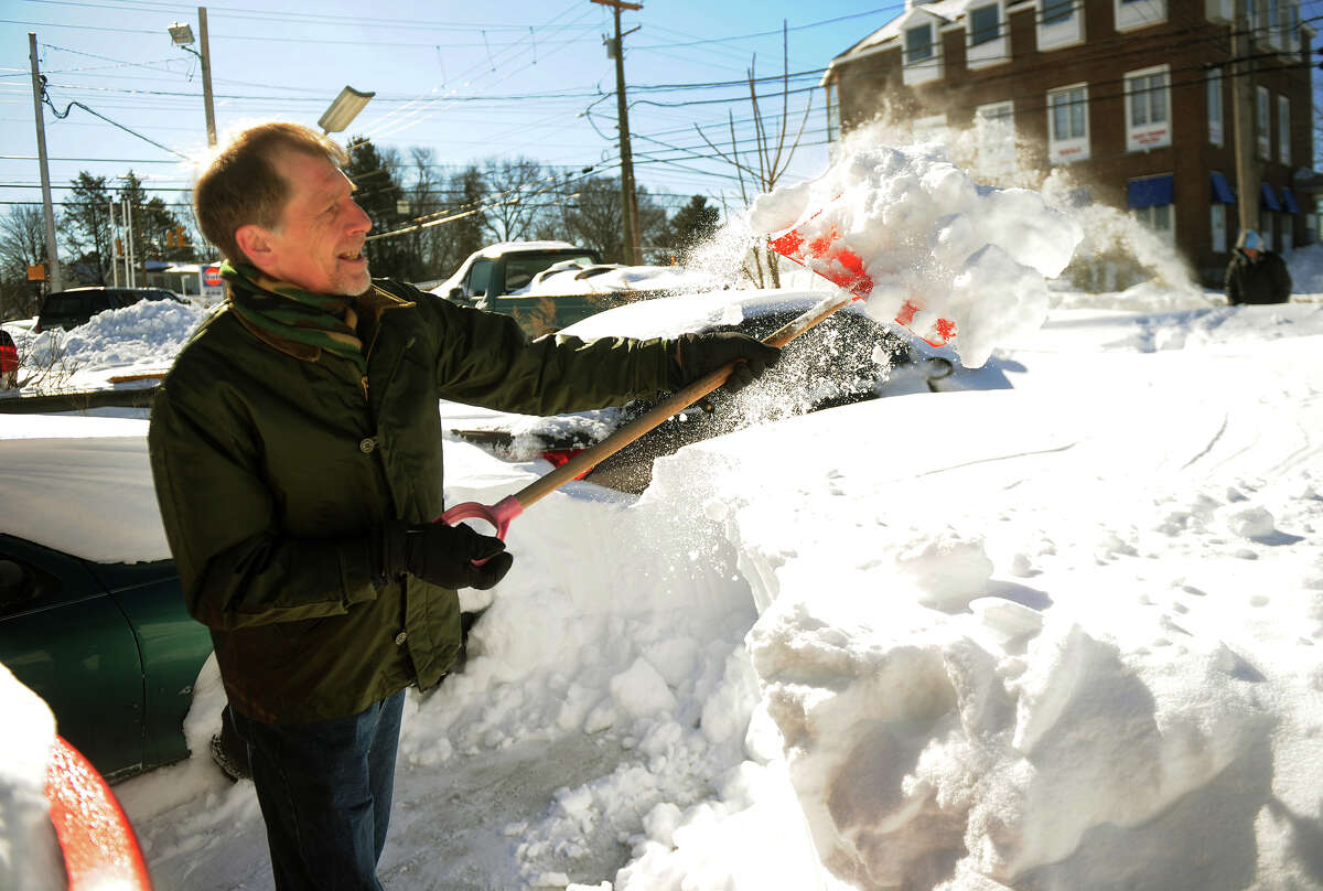 Bob Davis of Milford shovels over three feet of snow from his driveway on High Street in Milford, Conn. on Sunday, February 10, 2013.