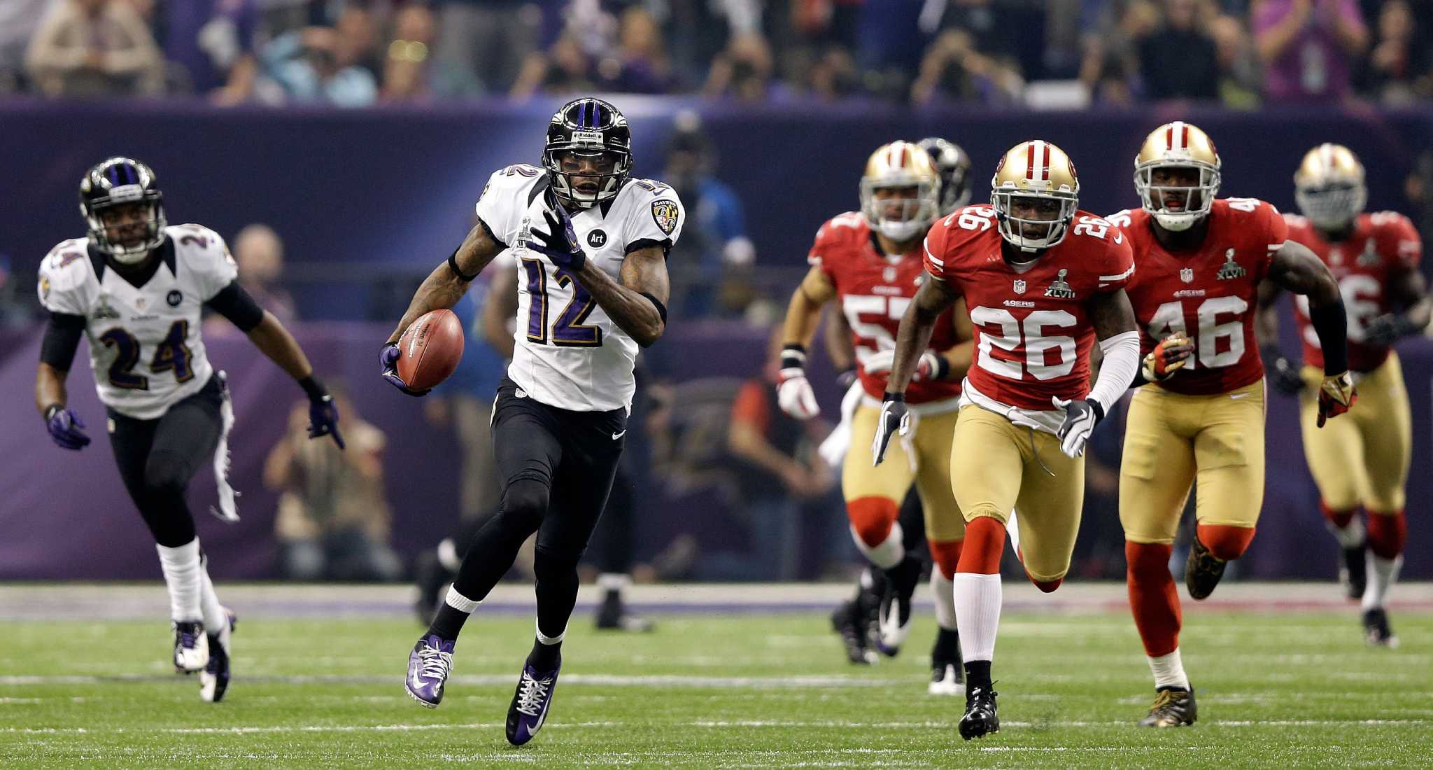 Ted Ginn Jr. #19 of the San Francisco 49ers standing on the field