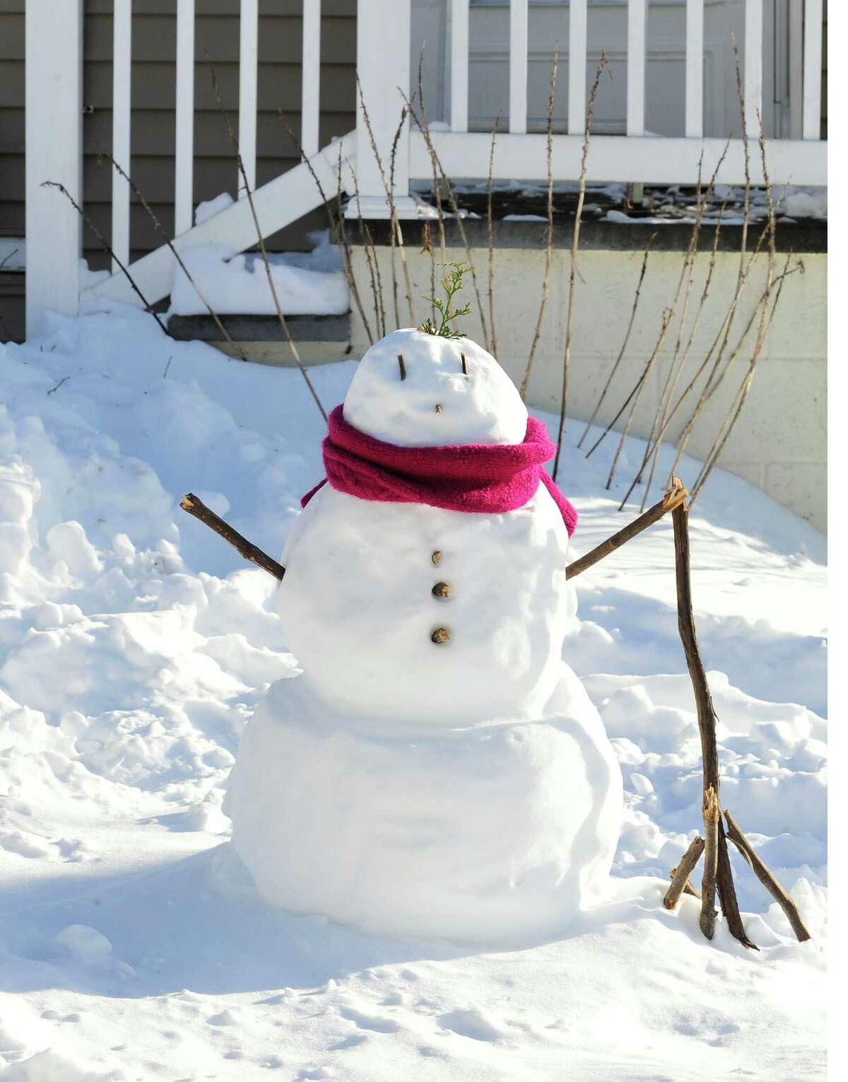 A snowman stands in front of a house on Rocky Glen Road in Danbury Sunday, Feb. 10, 2013.
