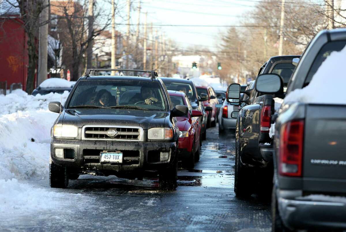 Gridlock traffic on East Main St. in Bridgeport, Conn. on Sunday Feb. 10, 2013.. Some major roads are plowed throughout city however not wide enough for two-way traffic. City officials still working around the clock to free residents from the effects of the weekend blizzard.