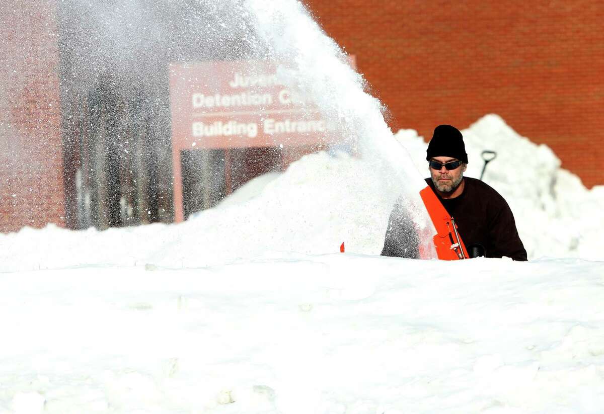 A worker makes walkway at the Juvenile Detention Center on Housatonic Ave. in Bridgeport, Conn. on Sunday, Feb. 10, 2013.