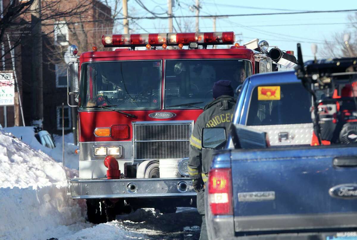 Mike Ross Connecticut Post freelance -Bridgeport firetruck attemping to get to a call gets stuck in traffic on East Main street on Sunday afternoon. City Officals are suggesting to residents please dont drive because of gridlock and the ongoing snow removal clean-up