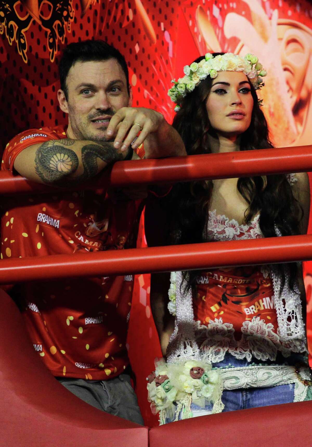 Megan Fox and her husband Brian Austin Green attend the carnival parades at the Sambadrome. (AP Photo/Hassan Ammar)