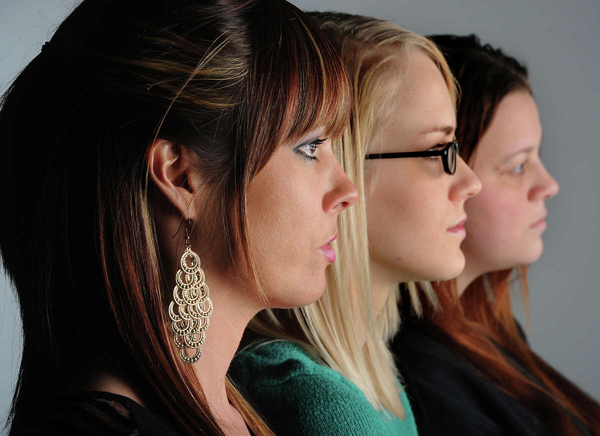 From left, Hollie Toups, 32, Marianna Taschinger, 22, and Kelly Hinson, 27, are among more than 20 Southeast Texan women to join in a class action lawsuit against a 'revenge porn' website that allows anonymous users to post intimate pictures of the women without their consent. Photo taken Friday, January 18, 2013 Guiseppe Barranco/The Enterprise