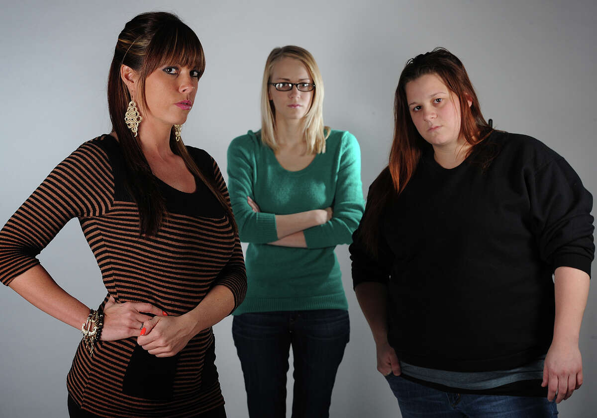 From left, Hollie Toups, 32, Marianna Taschinger, 22, and Kelly Hinson, 27, are among more than 20 Southeast Texan women to join in a class action lawsuit against a 'revenge porn' website. Photo taken Friday, January 18, 2013 Guiseppe Barranco/The Enterprise