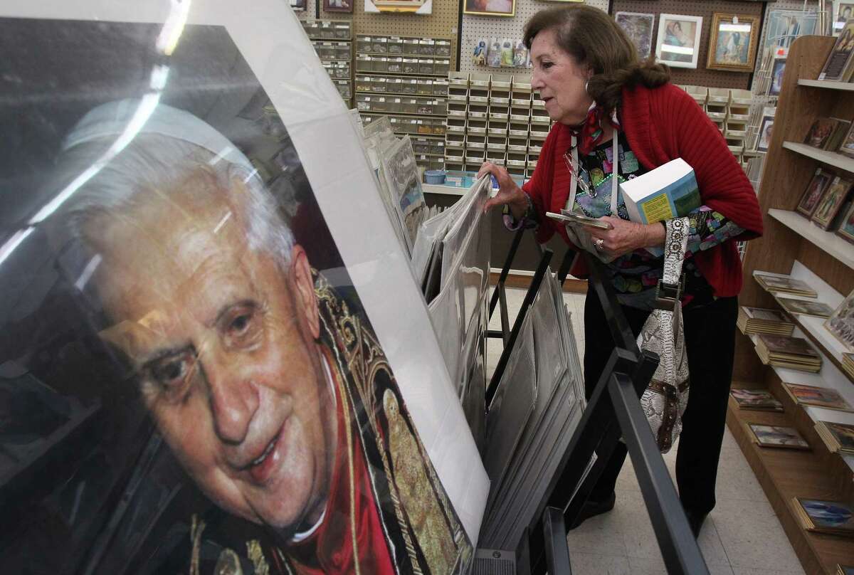 Elida Troutman browses Monday at the Sacco Catholic Bookstore, where a portrait of the pope is on display.