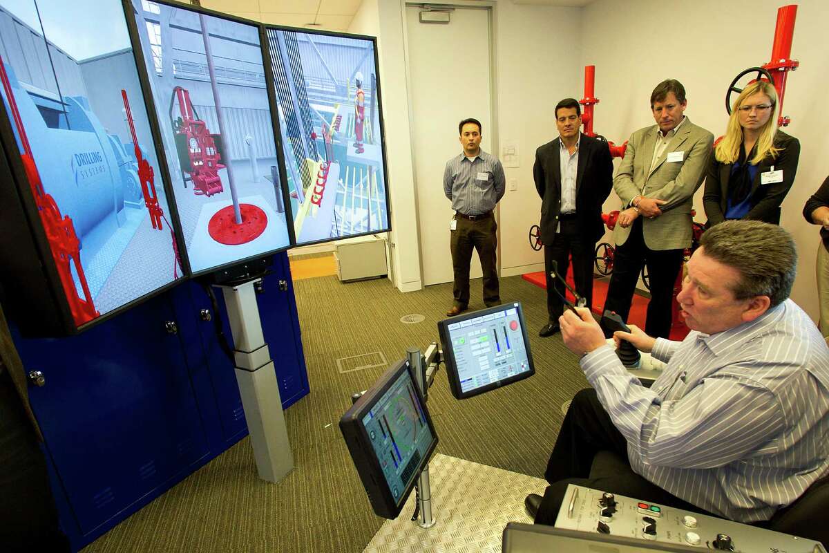 BP employee Jim Borthwick talks about safety and simulator training at the well monitoring facility at BP's West Houston campus. "We want to be the Harvard of well control," said Mark Venettozzi, a BP global training manager.