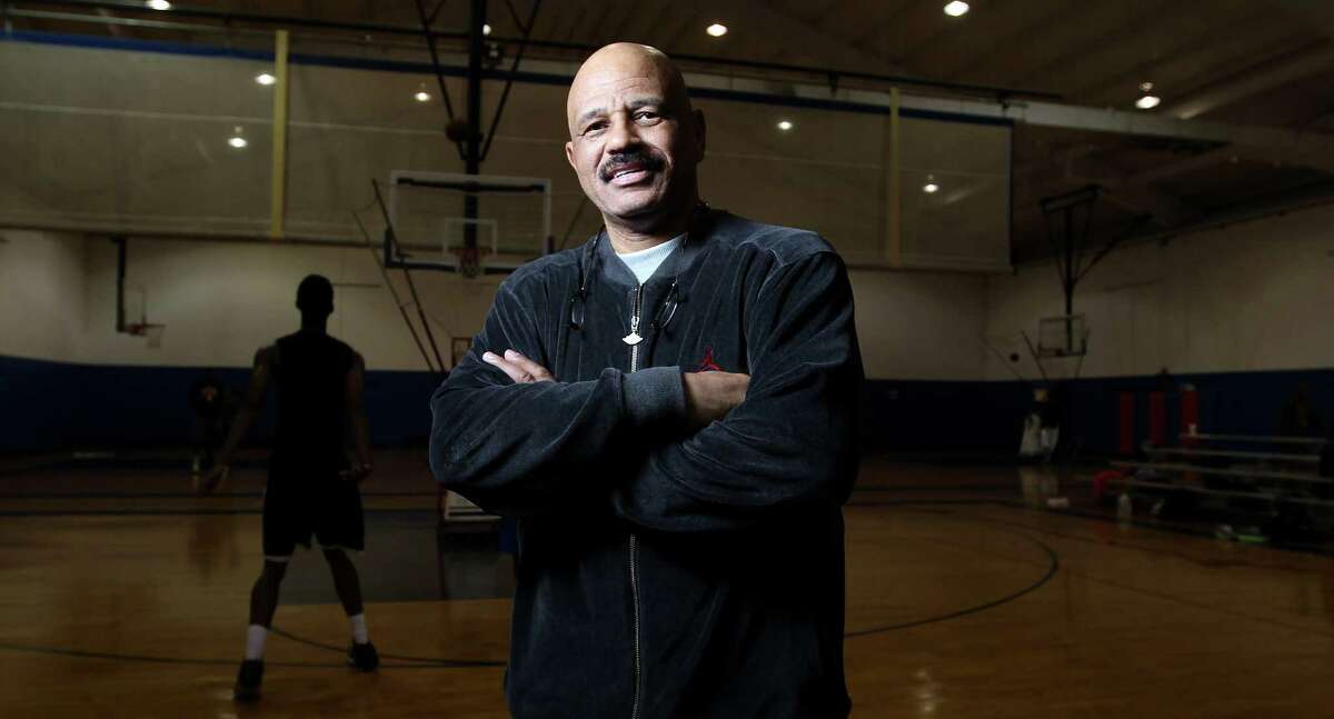 John Lucas, a former Houston Rocket, works with young basketball players at Lutheran North High School, Wednesday, Feb. 6, 2013, in Houston.