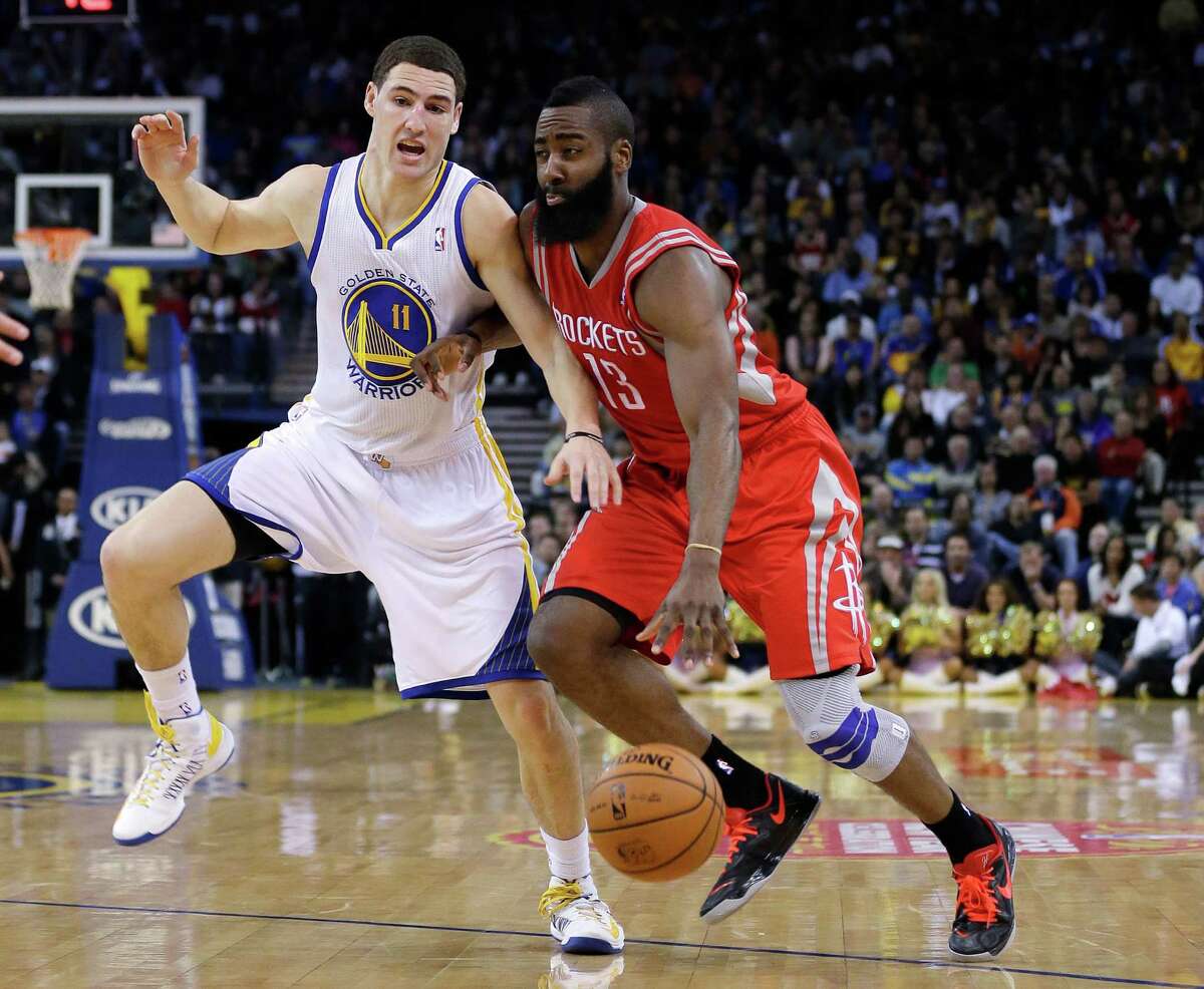 James Harden, driving on Klay Thompson, shook off knee pain to score 27 points.