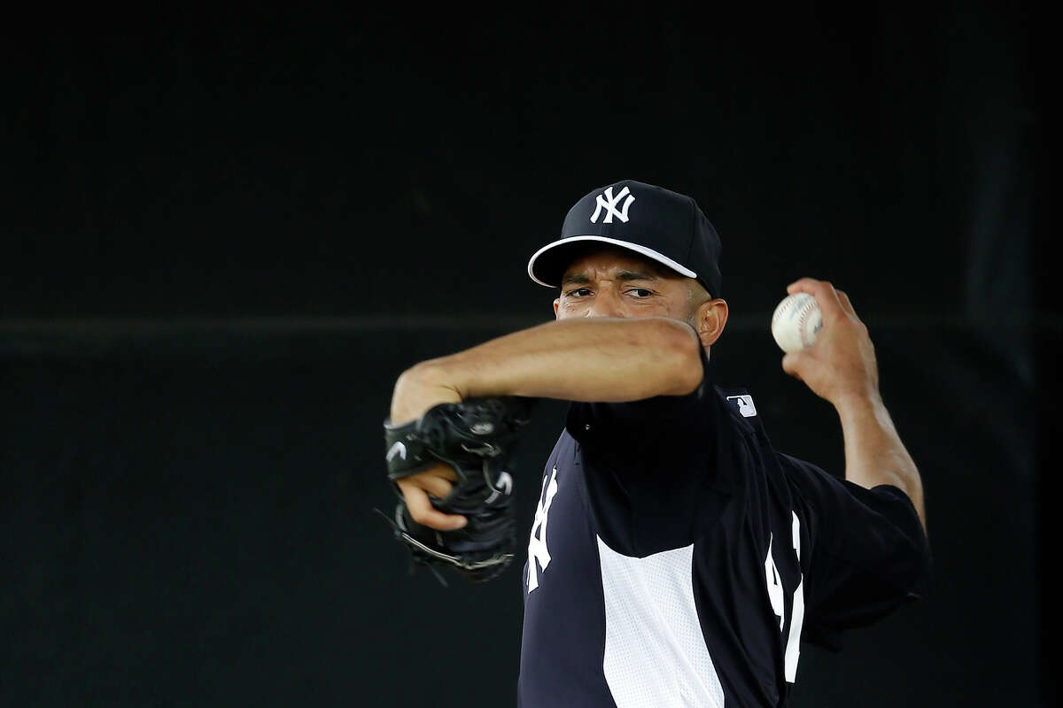 New York Yankees' Mariano Rivera throws in the bullpen during a workout at baseball spring training, Wednesday, Feb. 13, 2013, in Tampa, Fla. (AP Photo/Matt Slocum)