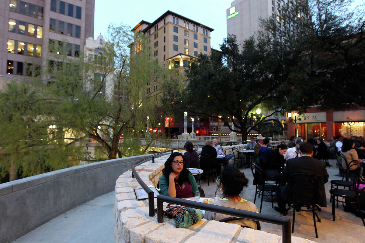 Dinner guests Teresa Ruiz (foreground) and her friend, Sylvia Galvan enjoy a mild evening on the patio at Lüke on Tuesday, Feb. 12, 2013. They were visiting the downtown restaurant during the city's Downtown Tuesday initiative which will soon mark its one-year anniversary. The initiative offers free parking and specials by participating businesses in an attempt to draw patrons to the downtown area.
