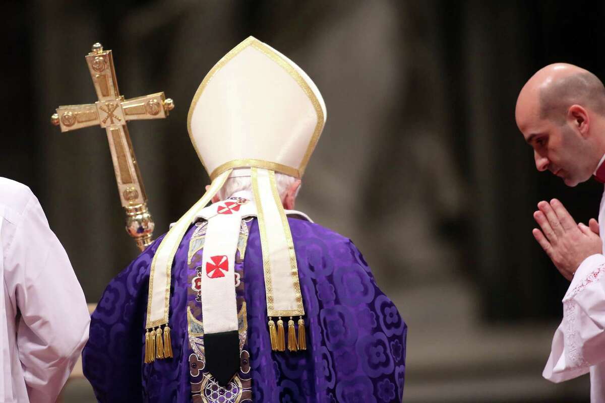 Pope Benedict XVI leads the Ash Wednesday service at St. Peter's Basilica in Vatican City. Benedict announced his resignation as pontiff Monday, citing declining health.