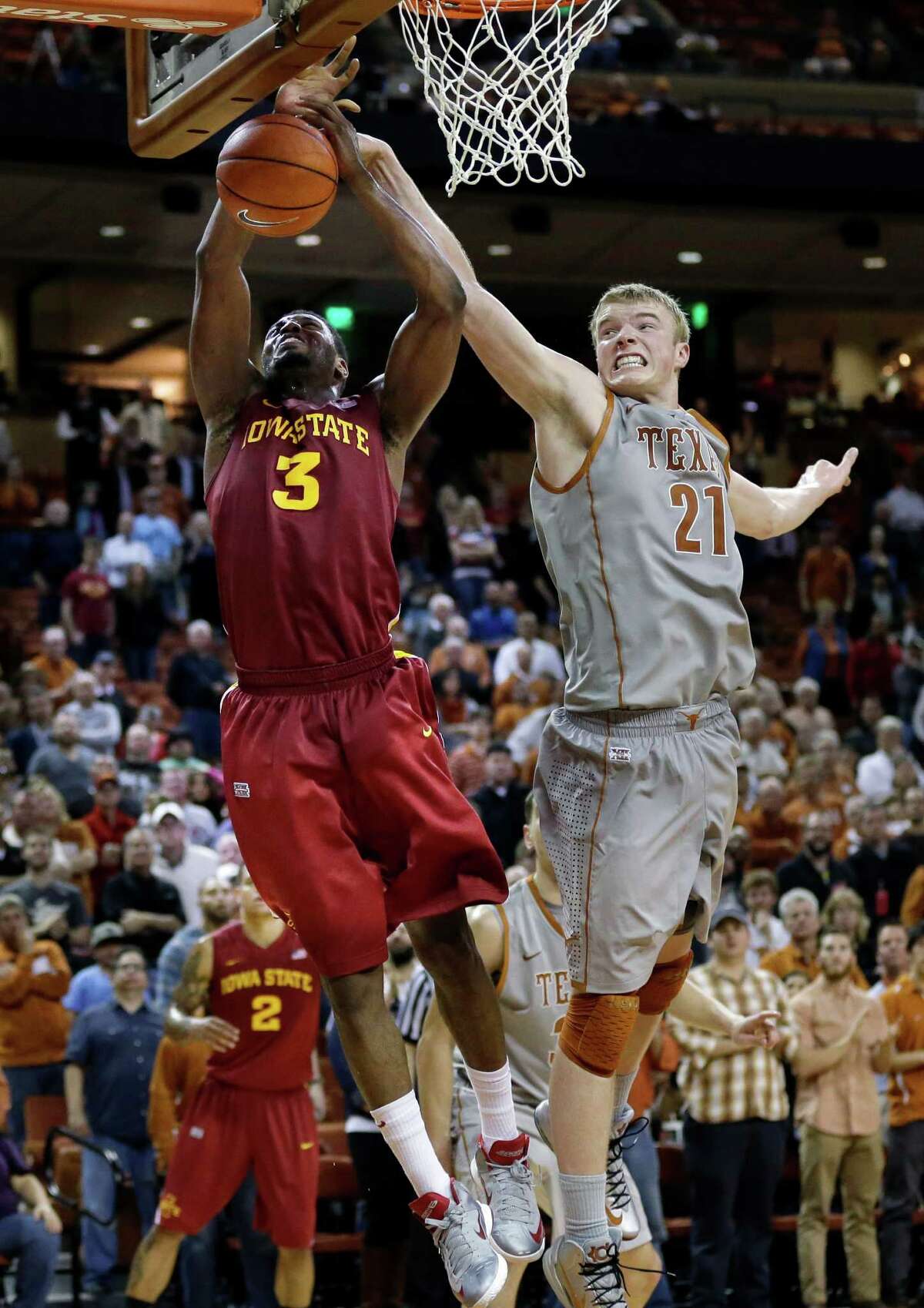Texas' Connor Lammert (21) blocks Iowa State's Melvin Ejim (3) during overtime of an NCAA college basketball game, Wednesday, Feb. 13, 2013, in Austin, Texas. Texas won 89-86 in double overtime. (AP Photo/Eric Gay)