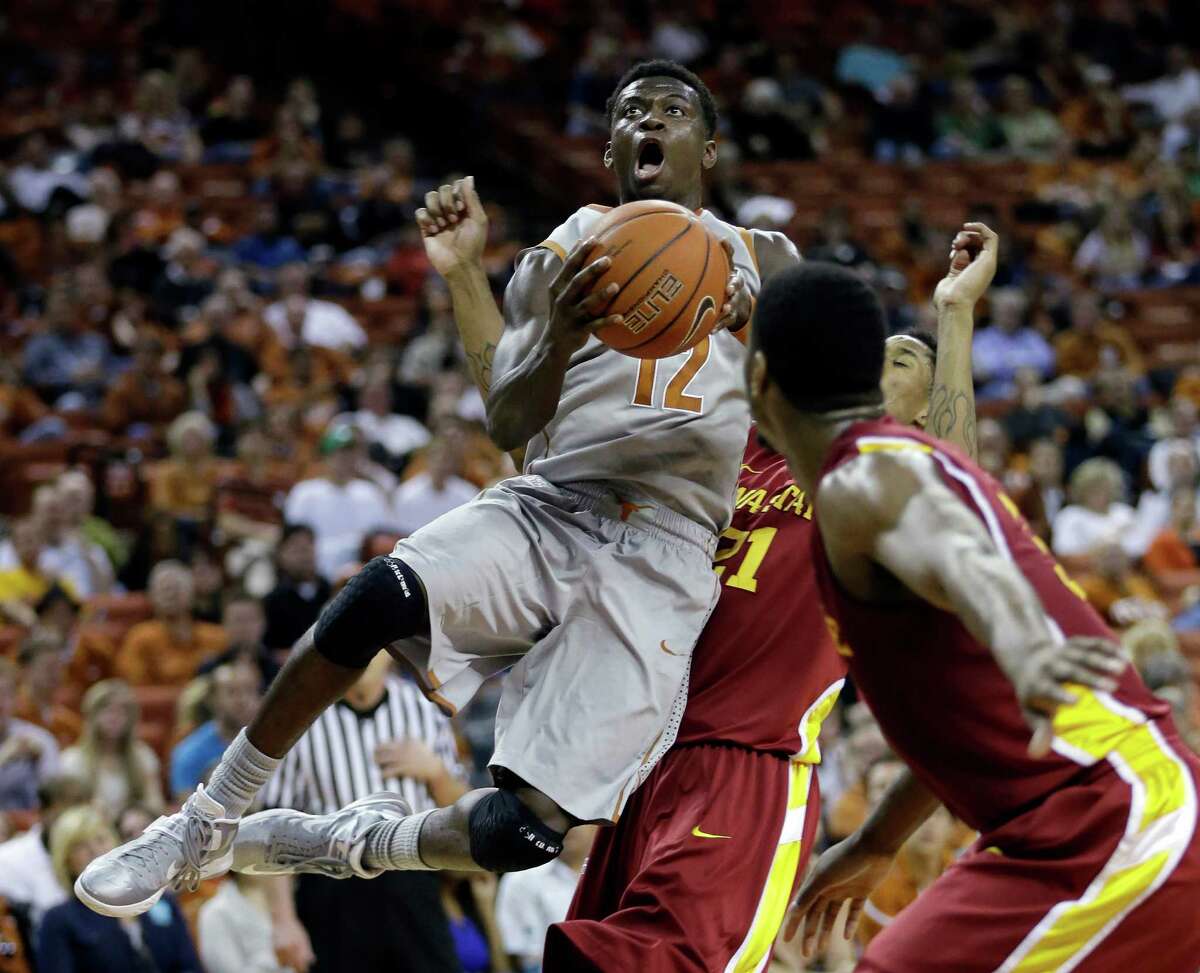 Texas' Myck Kabongo, soaring between Iowa State's Will Clyburn and Melvin Ejim, had 13 points and seven assists in his long-awaited season debut.