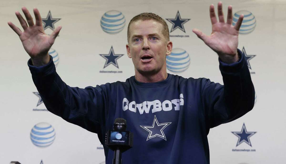 Cowboys coach Jason Garrett speaks to reporters and gestures Wednesday at the team's training facility in Irving.