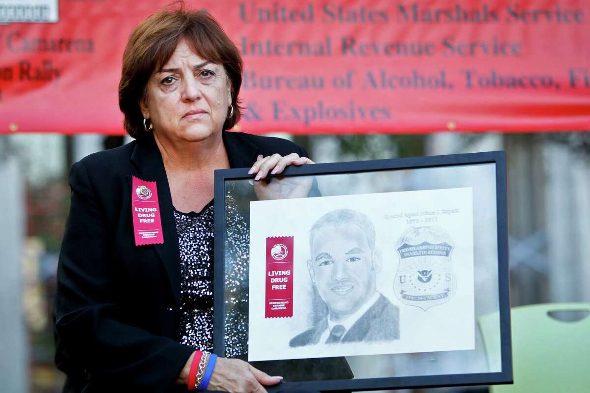 Mary Zapata, the mother of, slain immigration agent Jaime Zapata, holds a plaque depicting her son during the Enrique "Kiki" Camarena Red Ribbon Rally at Tranquility park, Friday, Oct. 21, 2011, in Houston. ( Michael Paulsen / Houston Chronicle )
