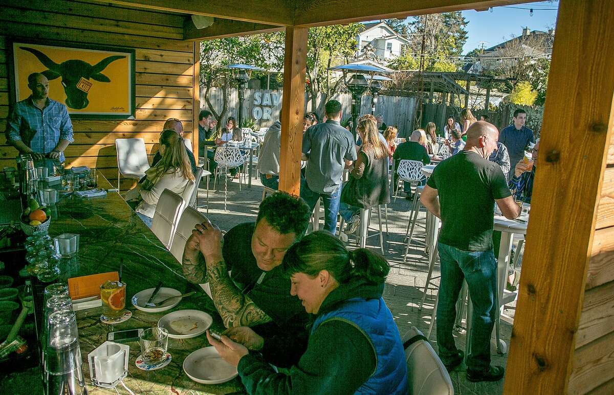 People enjoy the outside bar and patio at Bravas Bar de Tapas in Healdsburg, Calif. on Sunday, February 10th, 2013