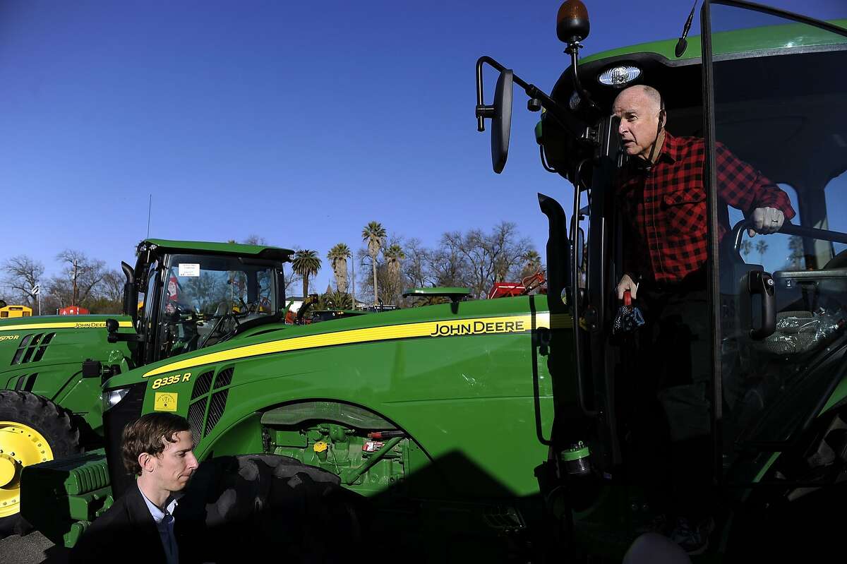 Gov. Jerry Brown tours the Colusa Farm Show Wednesday, Feb. 6, 2013 in Colusa, Calif. Brown wades into potentially hostile territory to pitch his $14 billion plan to remake the state's water-delivery system by building massive tunnels below the Sacramento-San Joaquin Delta. Farmers in the delta region and upriver from where the tunnels will be located are concerned about their water supply if the governor's push is successful. He says the tunnels are needed to ensure that water deliveries continue to Southern California cities and Central Valley farmers if the delta is hit by a natural disaster, such as an earthquake or sea level increases. (AP Photo/Appeal-Democrat, Chris Kaufman)